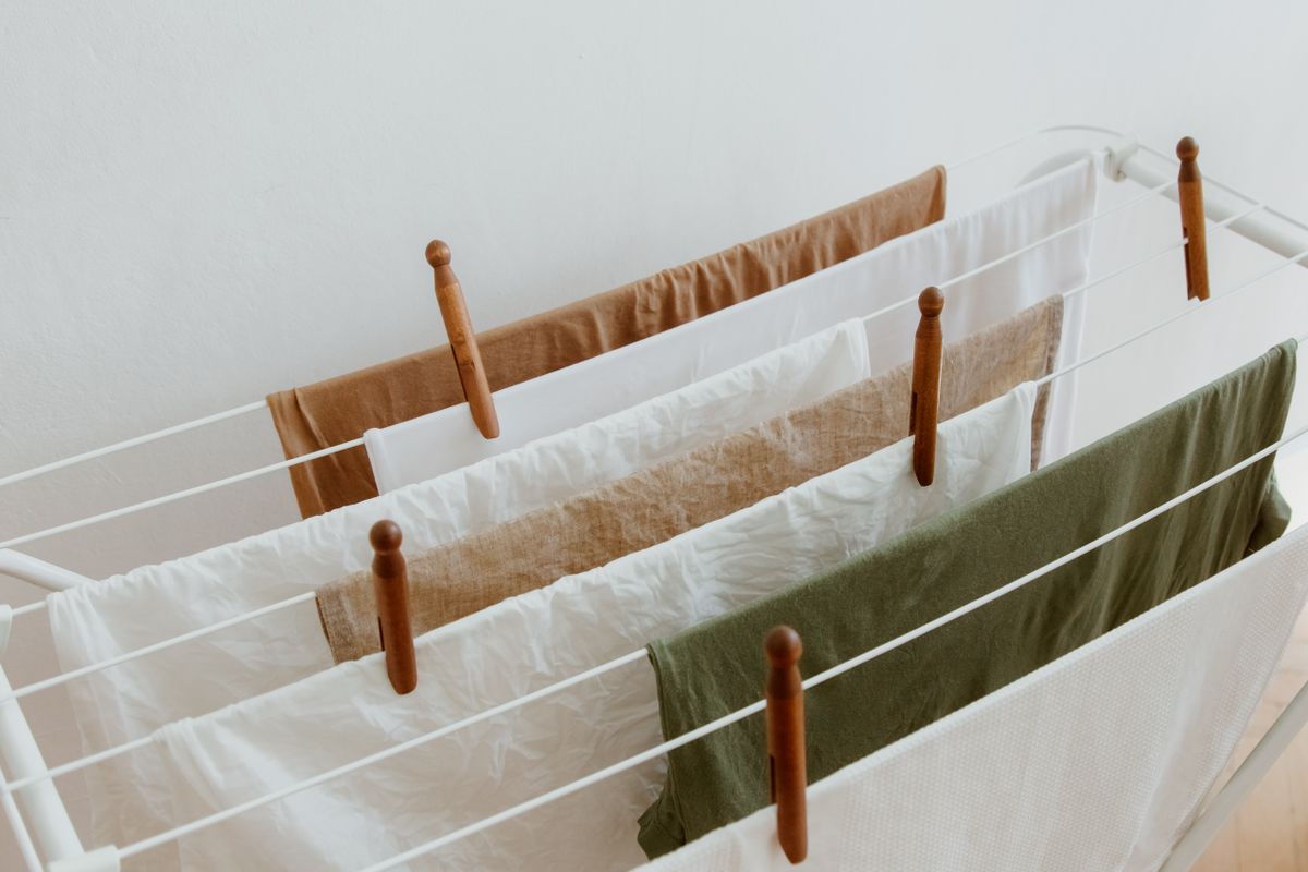 Laundry hanging to air-dry on an indoor clothes rack