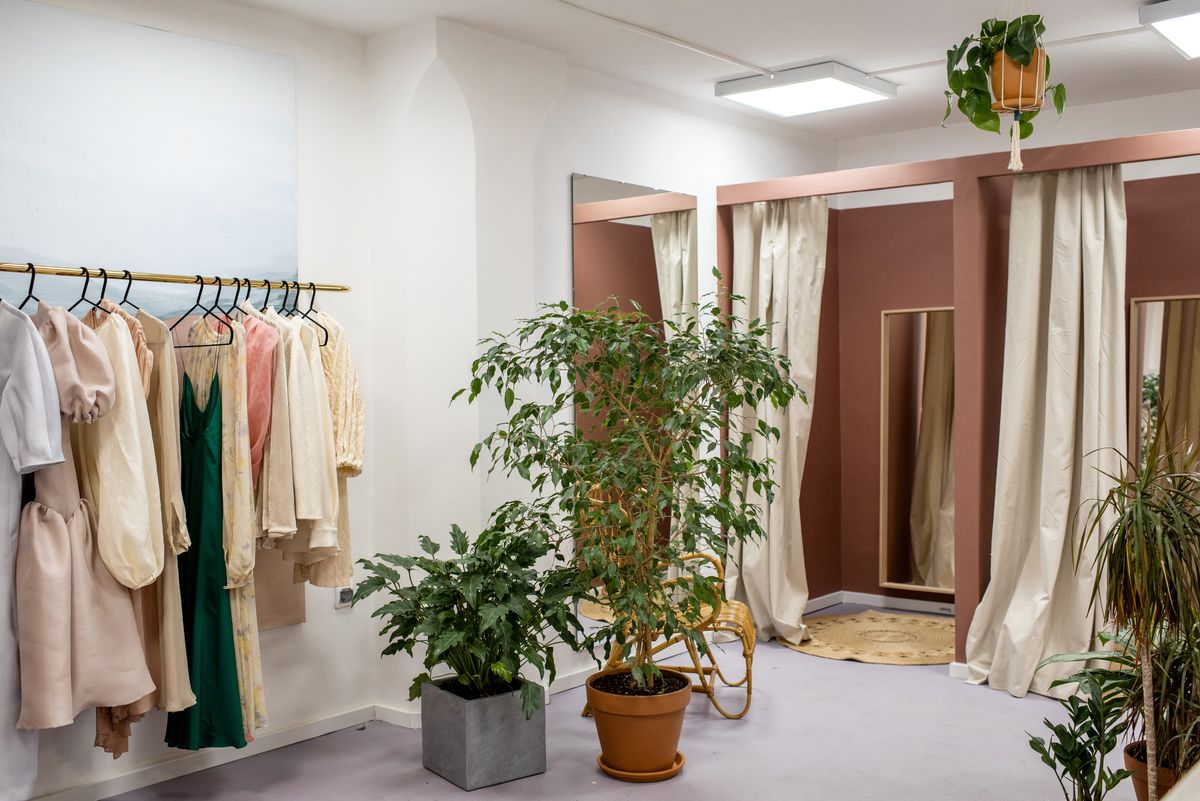 A boutique interior with garments displayed on racks