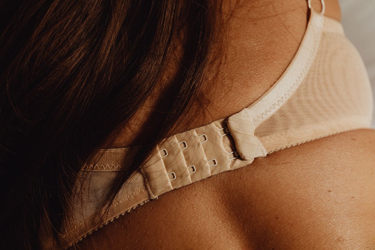Close-up of a bra back band and clasp, the part that rides up when a bra band is too big
