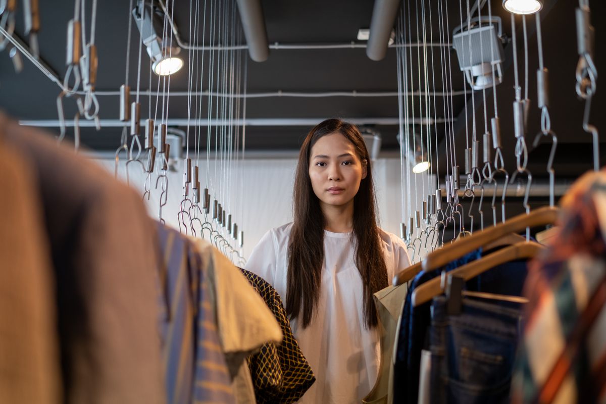 A woman browsing bra styles in a boutique