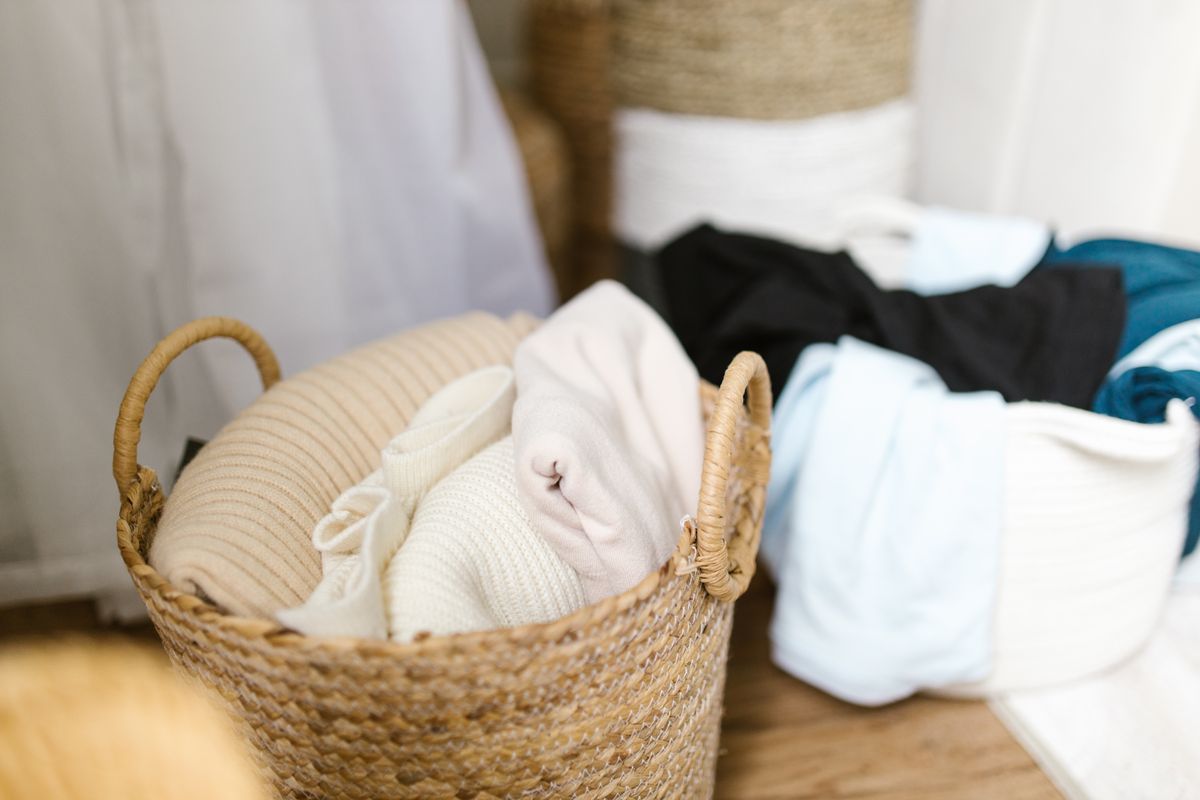 Soft clothes resting in woven baskets, illustrating how elastic garments need time to recover between wears